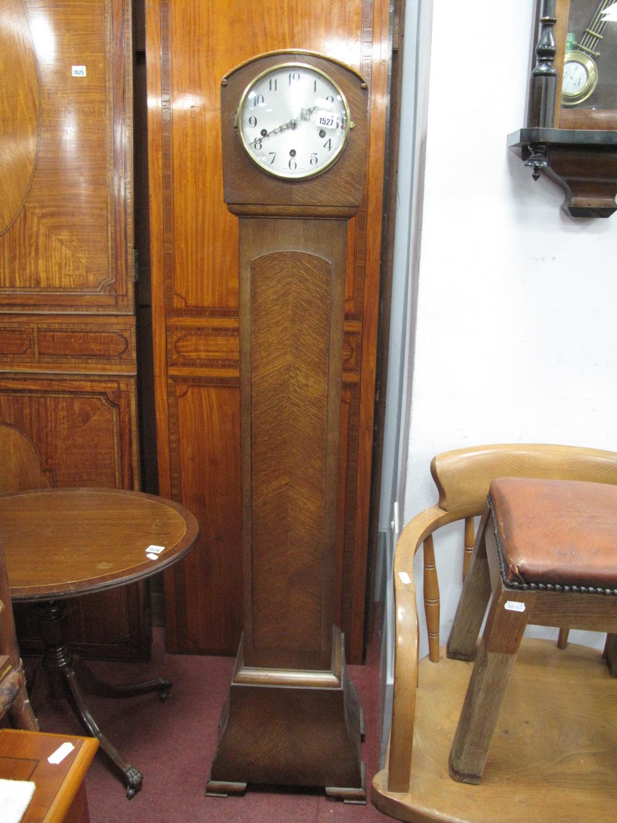 A 1930's Oak 'Enfield' Grandmother Clock, silver dial shaped base, on bracket feet, 144cm.