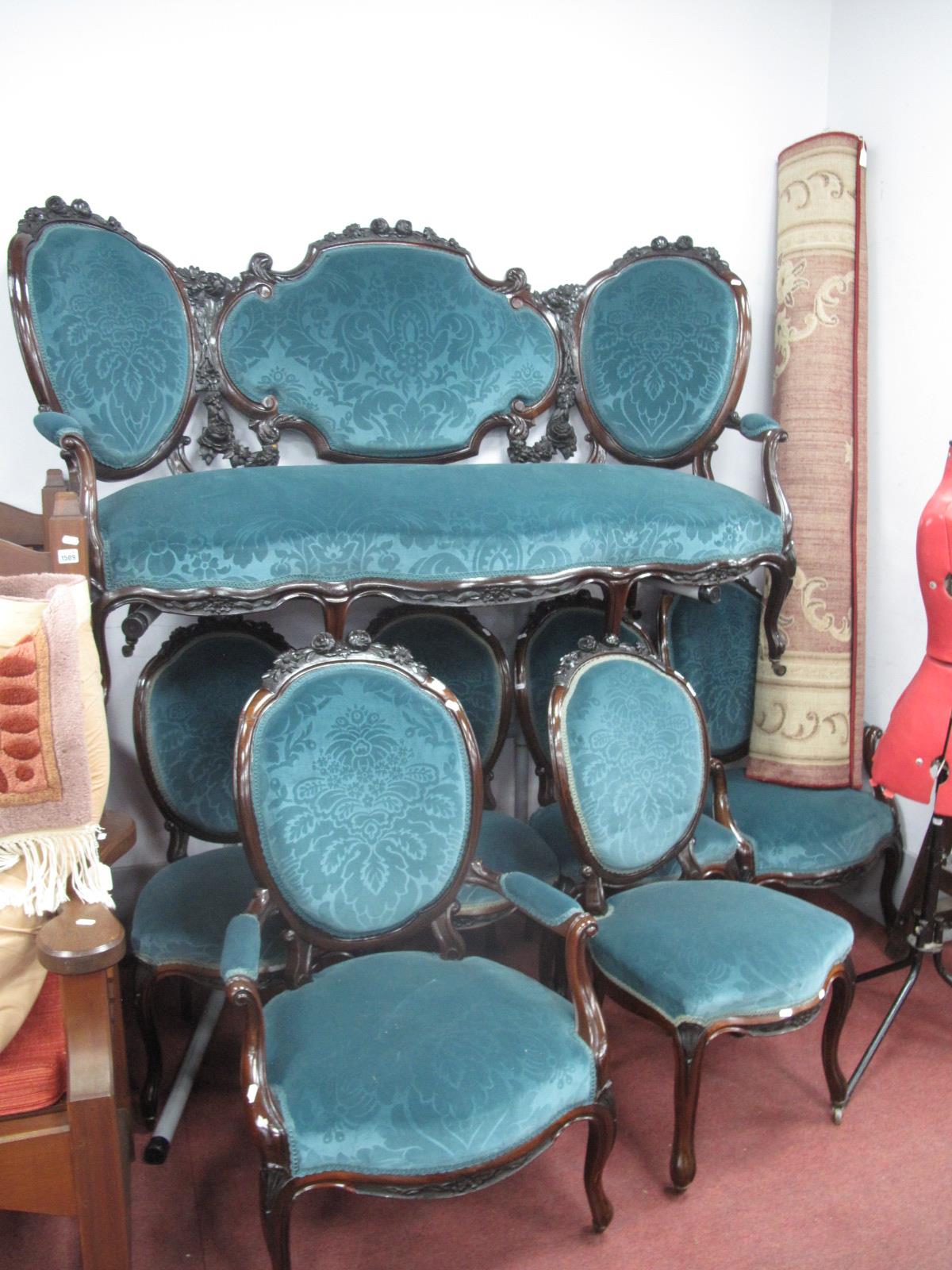 A Mid XIX Century Rosewood Seven Piece Salon Suite, settee, six chairs (four single two arm) with