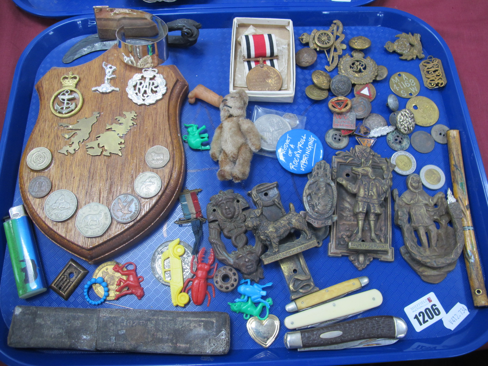 Inox and Other Knives, door knockers, mini gold plush terry, military badges, etc:- One Tray