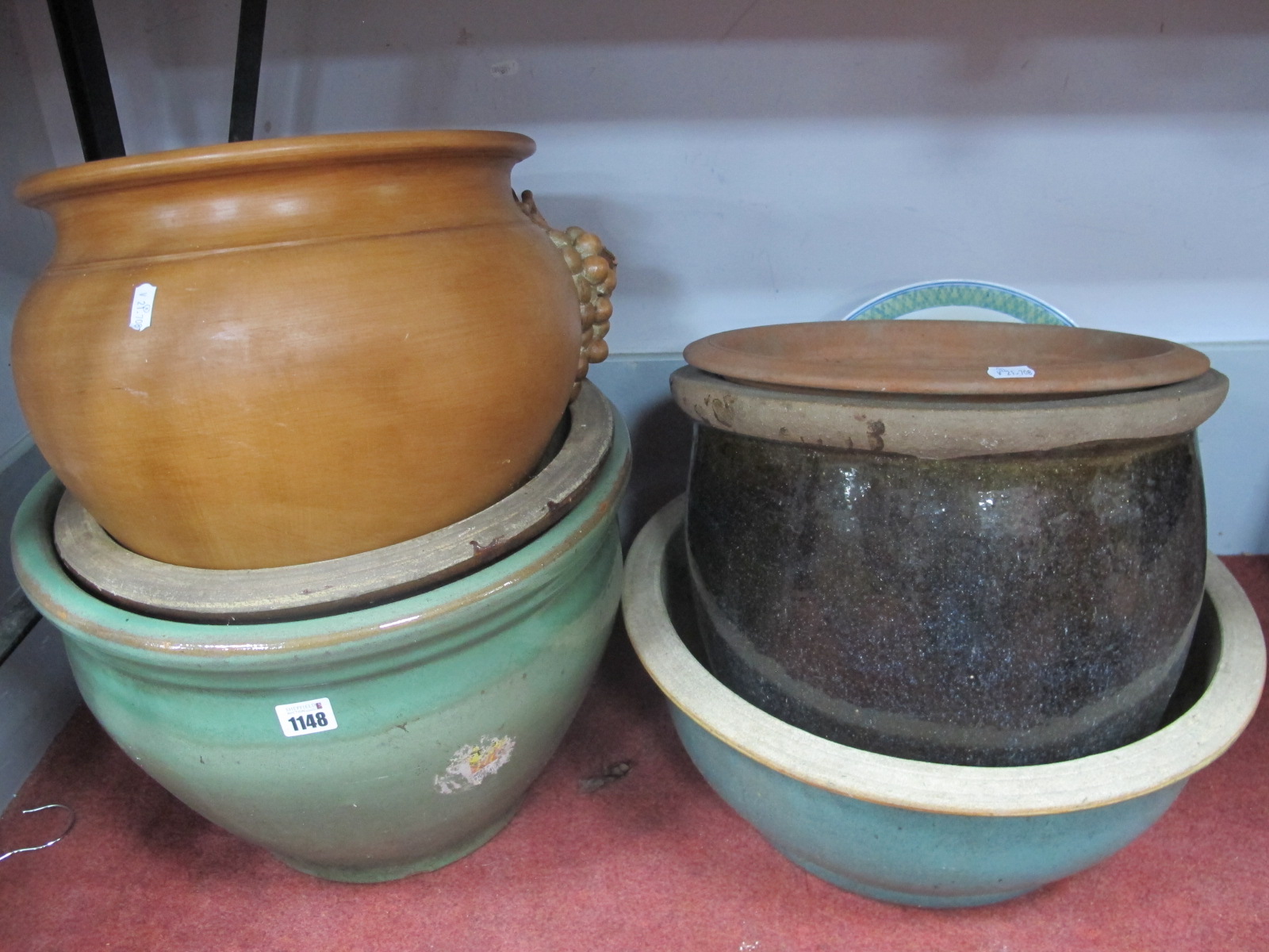 Four Glazed Pottery Planters, three terracotta effect examples, two stands.