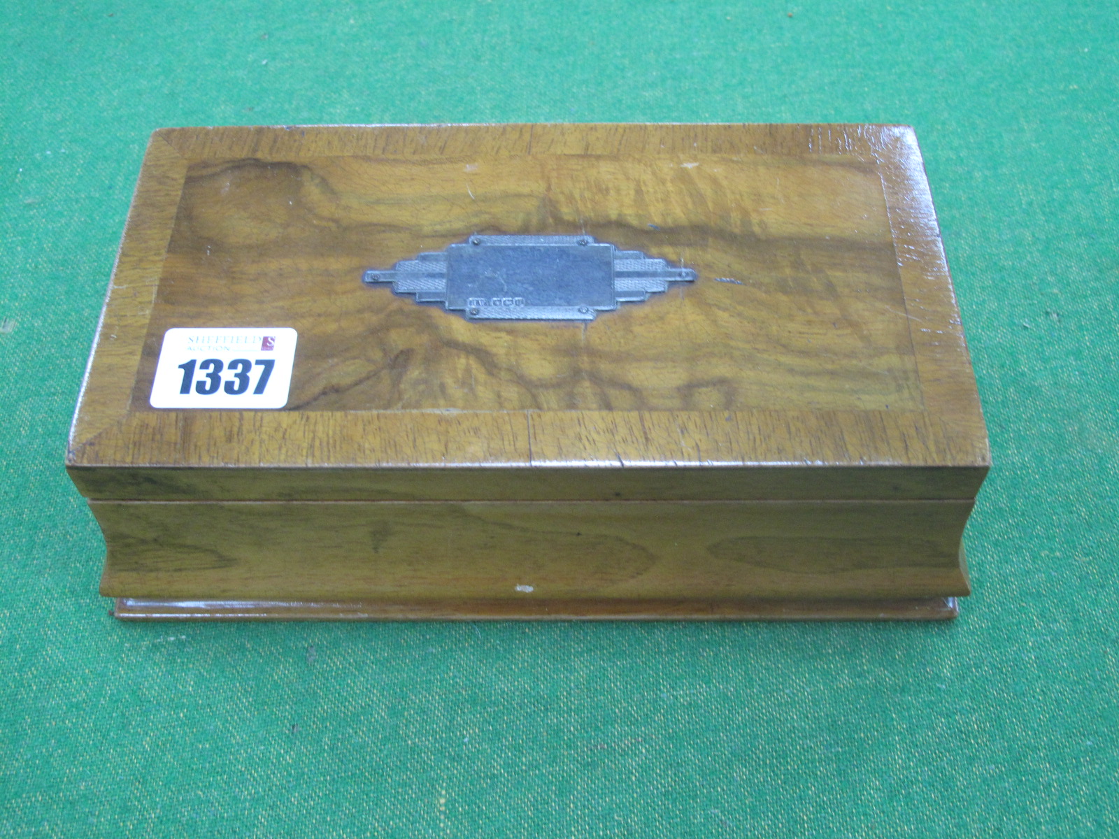 An Art Deco Walnut Trinket Box, with engine turned silver blank name plate, 21.5cm wide.