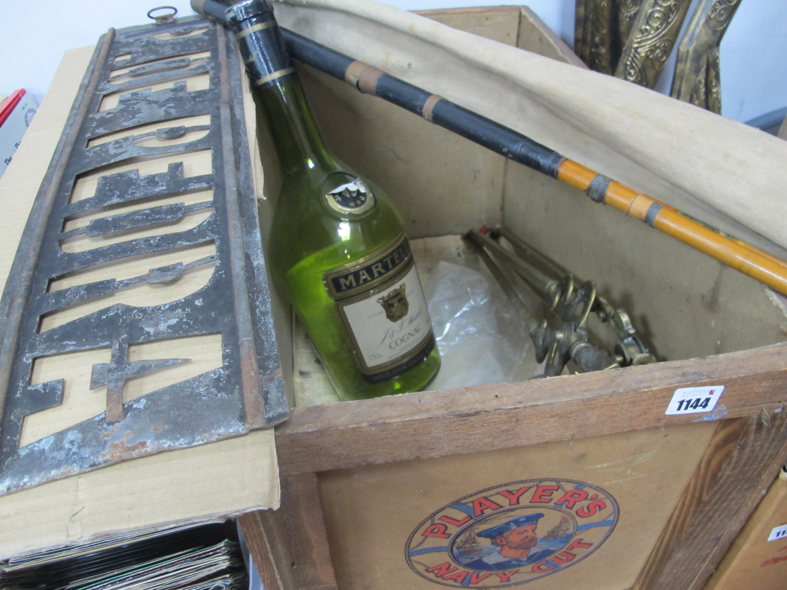 Players Please Tobacco Box, P De Pedra stencil, brass fire irons, Martell bottle, fishing rod.