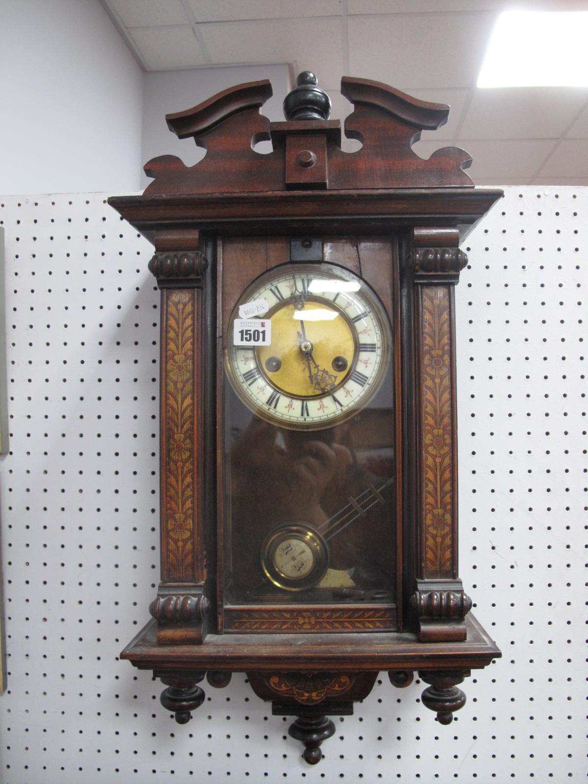 A Late XIX Century Vienna Wall Clock, with a broken pediment, circular dial, Roman numerals, columns