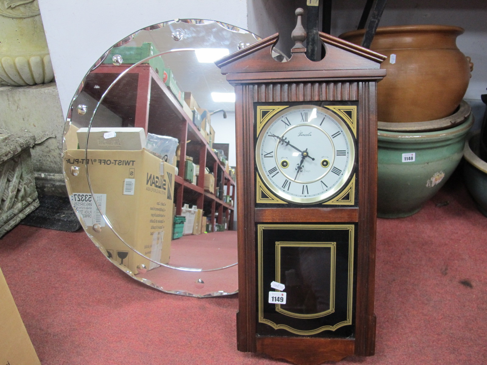 A Lincoln 31 Day Wall Clock, circular wall mirror, 60cm diameter.