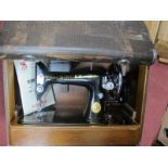 Singer Sewing Machine, in reptile skin effect case.