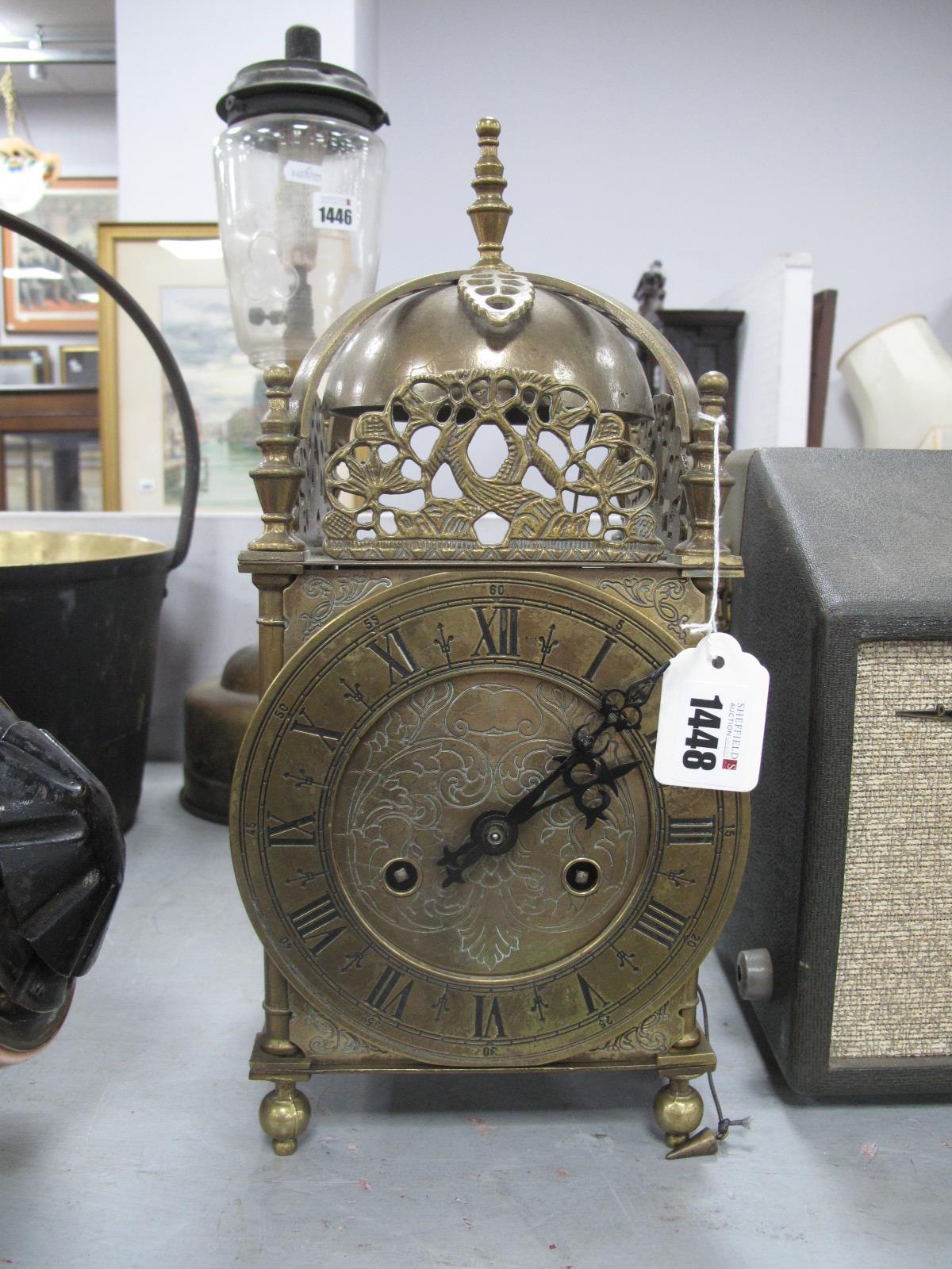 A XVII Style Brass Lantern Clock, with a finial top, circular dial, Roman numerals, with a German