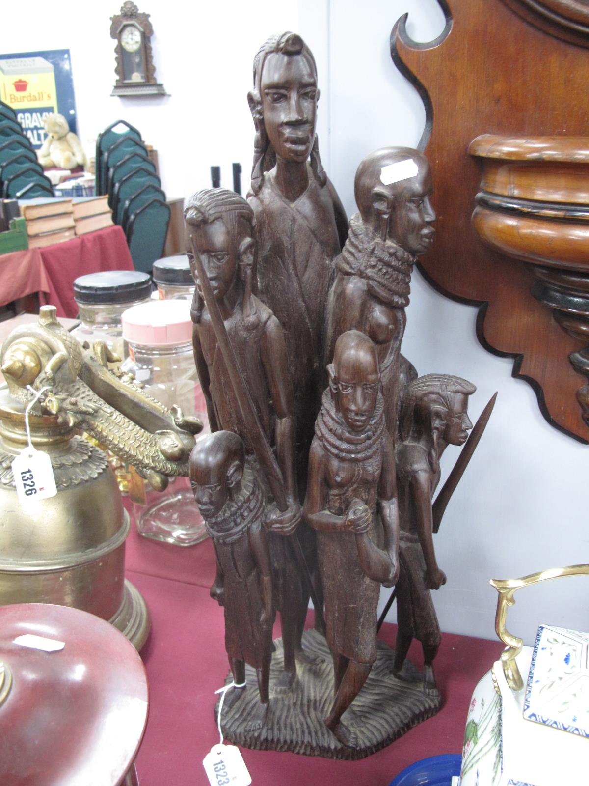 Ethnographic, Carved hardwood figure group of six family members, on grooved base, 56cm high.
