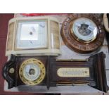 An Early XX Century Circular Aneroid Barometer, bakelite table top barometer; together with a