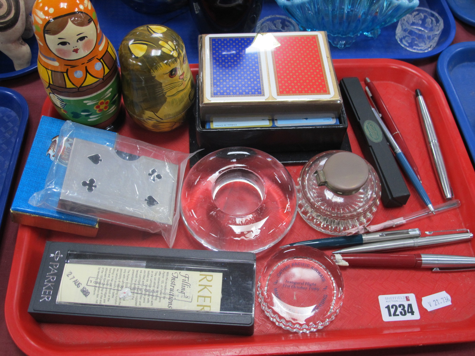 Playing Cards, writing pens, inkwells, Russian graduated dolls:- One Tray.