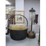 A Tilley Table Lamp, brass jam pan with iron loop handle, 35.5cm diameter (2).