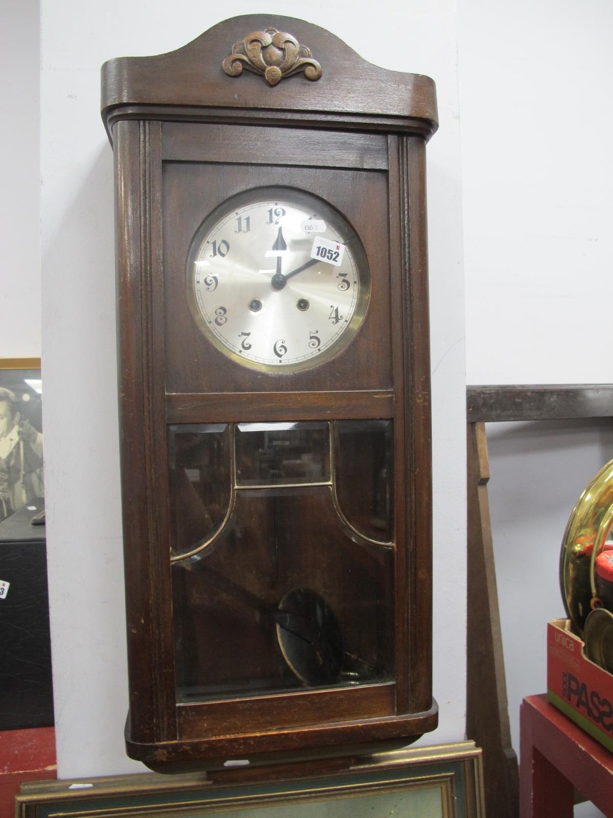 A XX Century Oak Wall Clock, with a silvered dial, glazed door.