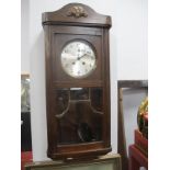 A XX Century Oak Wall Clock, with a silvered dial, glazed door.