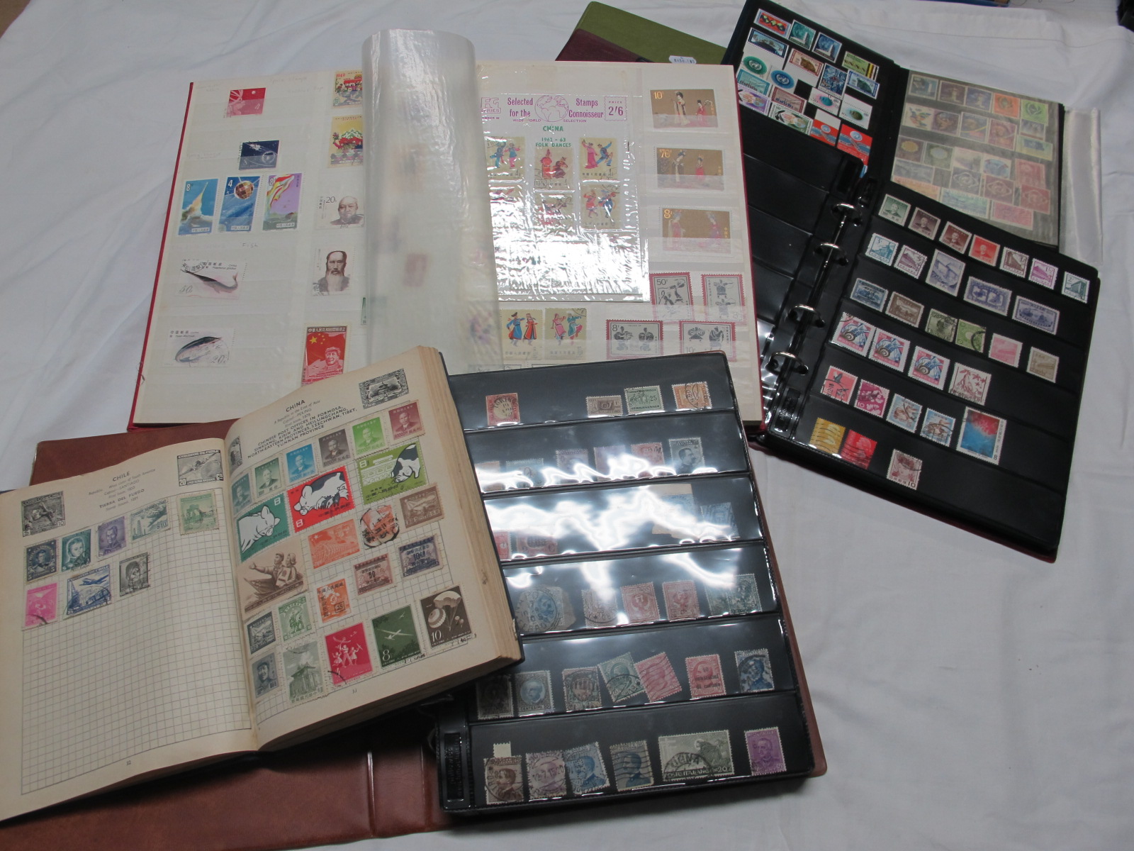 A Collection of Worldwide Stamps, early to modern, housed in three albums and two stock books.