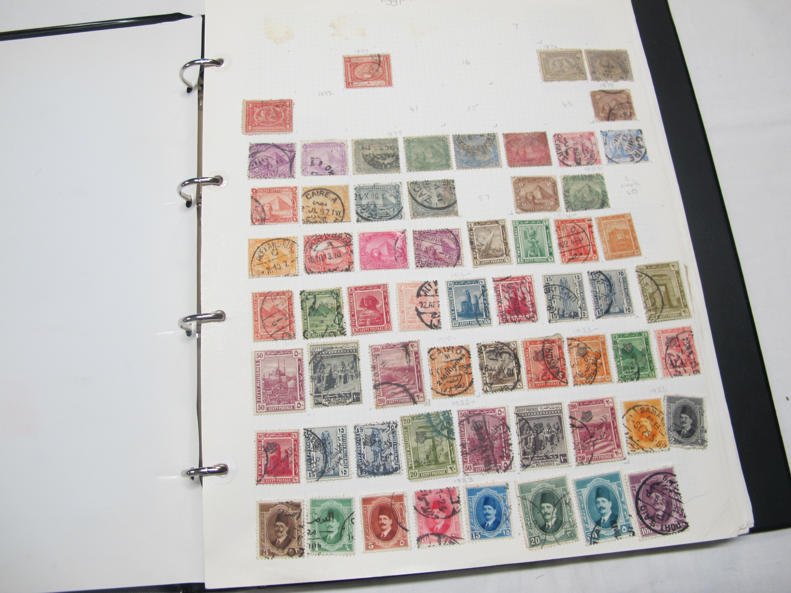 A Collection of Stamps From Egypt and Ecuador, early to modern, housed in a loose leaf album.