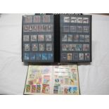 A Collection of Mint G.B Stamps, from Pre-Decimal QEII to Decimal 1999, housed in a red stockbook,