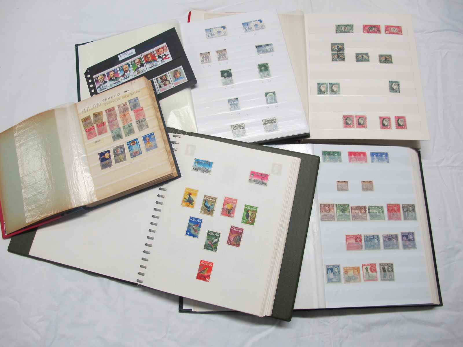 A Collection of British Commonwealth Stamps, early to modern, featuring countries Malaya, Cyprus,