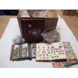 An Accumulation of World Stamps, early to modern, housed in junior albums and loose in bags, (
