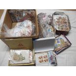 A Carton of Used Stamps, on and off paper from Queen Victoria to modern, in bags and small boxes.