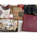 A Large Accumulation of Worldwide Stamps, early to modern, in albums and loose on and off paper,