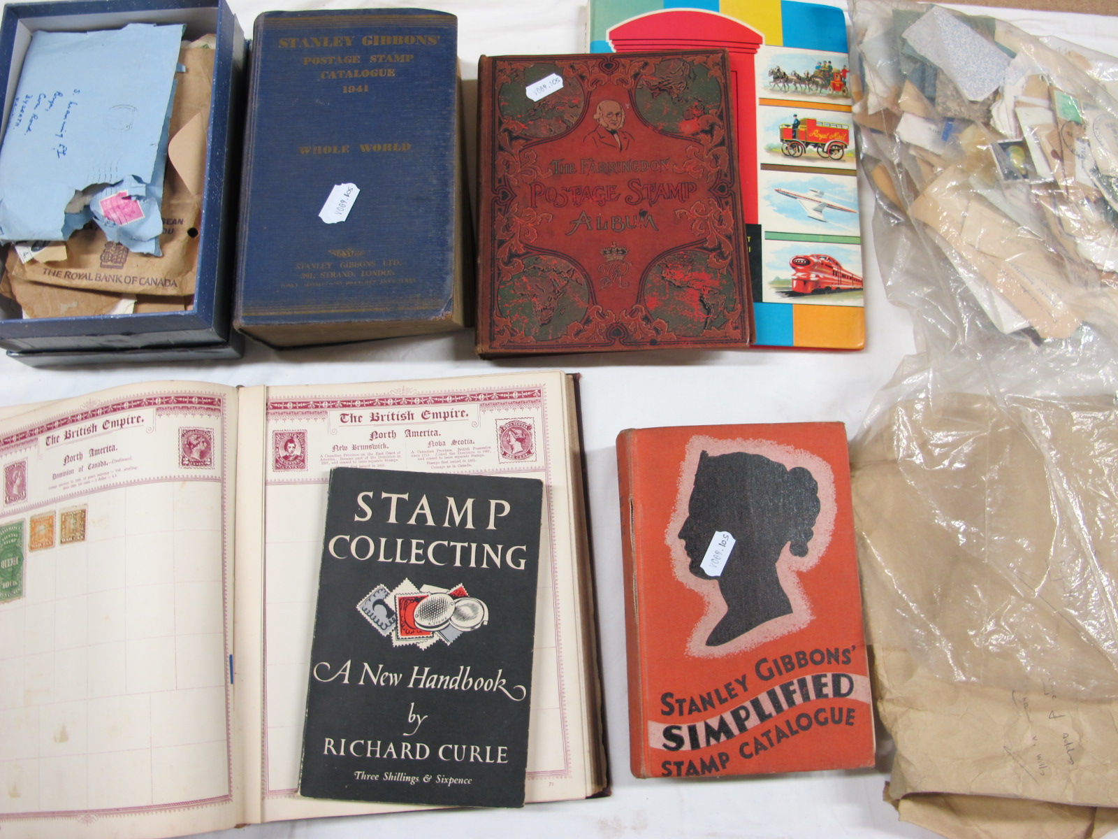 An Accumulation of Worldwide Stamps, early to modern, housed in three albums (sparsely filled), plus