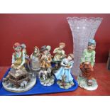 Nine Capodimonte Figurines, the tallest 24cm, a waisted cut glass vase (damages noted).