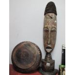 Ethnographica Carved Softwood Elongated Mask, with rope as hair, on semi circular base, 77cm high,
