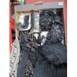 A Mid XX Century Black Jackets, black bead work costume decorations, tins, etc:- One Box.