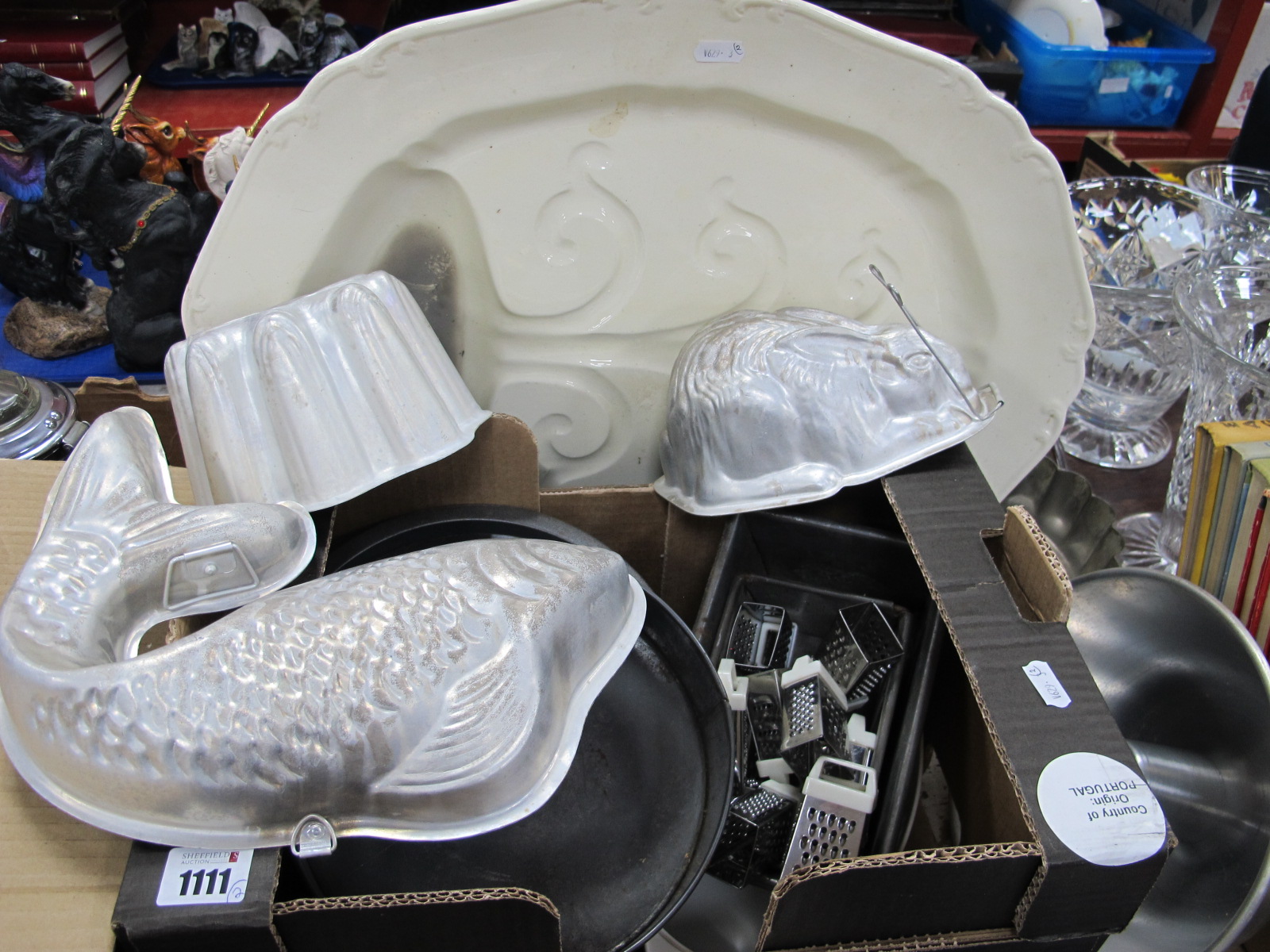 Ivory Pottery Meat Plate, with well; a small collection of aluminum and other moulds, cake tins,