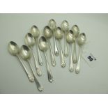 A Set of Twelve Hallmarked Silver Coffee Spoons, Walker & Hall, Sheffield 1933, each with golf