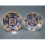 A Pair of Derby Porcelain Saucer Dishes, decorated with stylised foliage and central star motifs