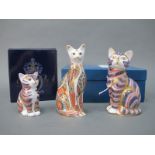 Three Royal Crown Derby Porcelain Paperweights, 'Siamese Cat', 'Cat' and 'Kitten', gold stoppers,