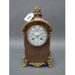 A Mid XIX Century French Boulle Mantle Clock, with ormolu mounts, the shaped rectangular body raised