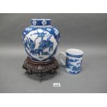 A Chinese XIX Century Porcelain Tankard, painted in blue with a Chinoiserie river landscape,12cm