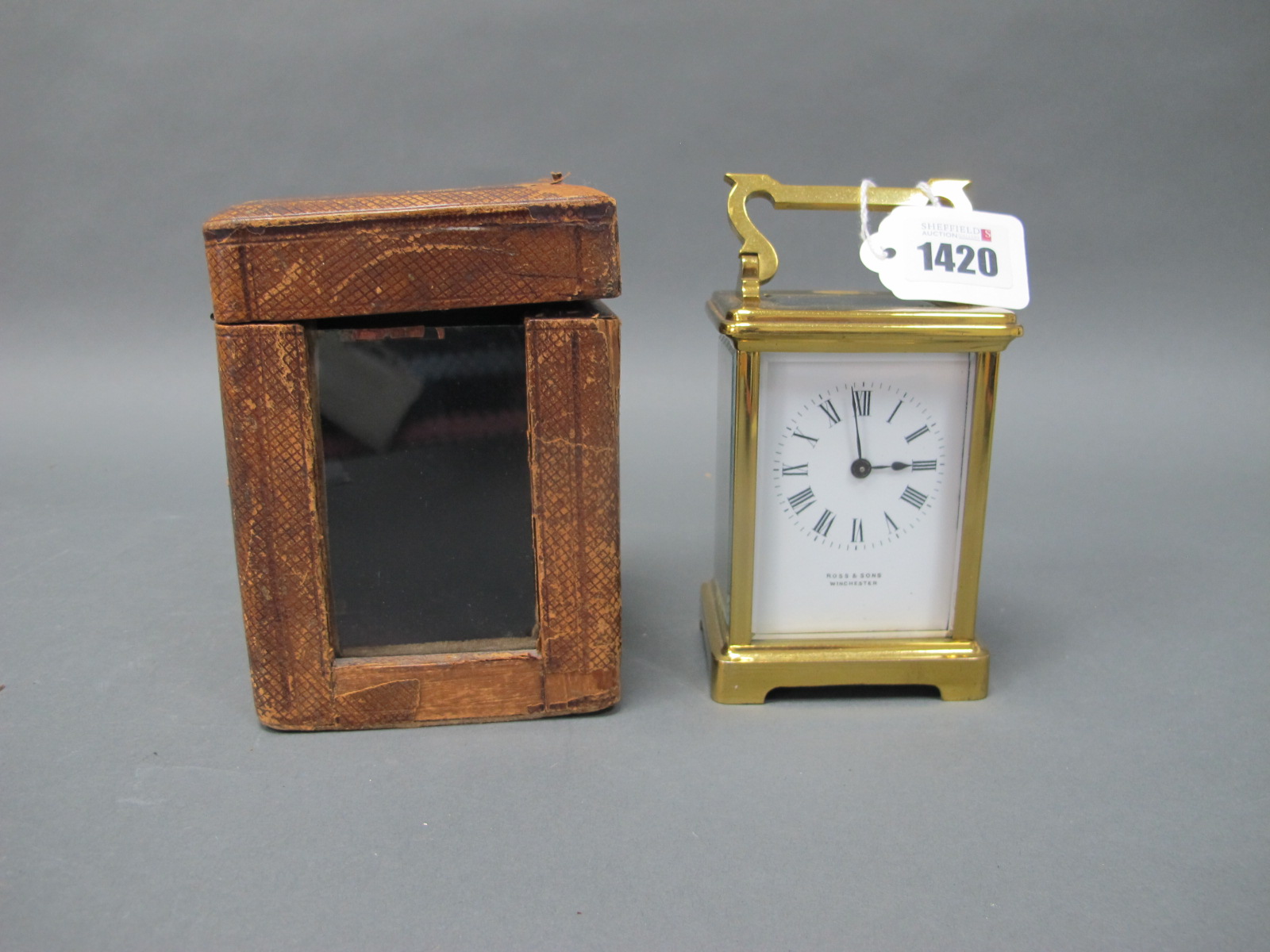 A Late XIX/Early XX Century Brass Carriage Clock, the white enamel dial with Roman numerals,