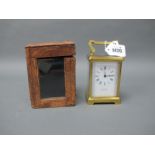 A Late XIX/Early XX Century Brass Carriage Clock, the white enamel dial with Roman numerals,