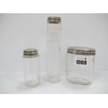 Two Late XIX Century Fluted Clear Glass Dressing Table Jars and an Oval Example, each with