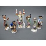 A Set of Six German Porcelain Early XX Century Monkey Band Figurines, each in colourful costume