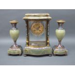 A French Mid XIX Century Onyx and Champléve Enamel Clock Garniture, the clock of serpentine form