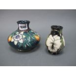 A Moorcroft Pottery Vase, of squat globular form, painted in the 'Passion Flower' pattern against