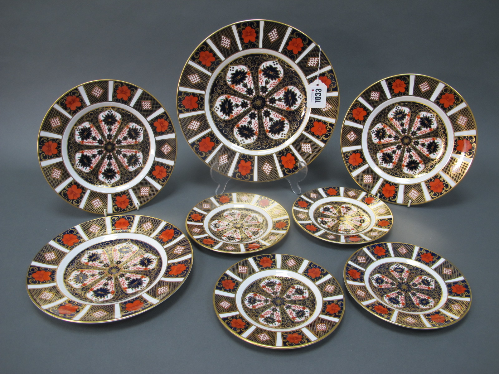 Eight Royal Crown Derby Plates, decorated in Imari pattern 1128, comprising one dinner plate, 26cm