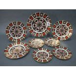 Eight Royal Crown Derby Plates, decorated in Imari pattern 1128, comprising one dinner plate, 26cm