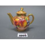 A Royal Worcester Porcelain Miniature Teapot and Cover, of globular form with flower knop, painted