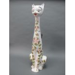 A 1960/70's Italian Pottery Model of a Seated Cat, decorated with pink flowers, 73.5cm high.