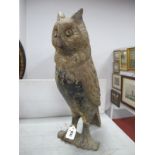 A Late XIX Century Painted Cast Iron Model of an Owl, perched on a branch, 49cm high.