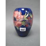 A Moorcroft Pottery Vase, of ovoid form, painted in the Anemone pattern with pink and purple flowers