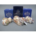 Three Royal Crown Derby Porcelain Paperweights, 'Contented Kitten', 'Contented Cat' and 'Cottage