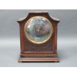 An Early XX Century Mahogany Cases Mantle Clock, the arched case with carved side columns and