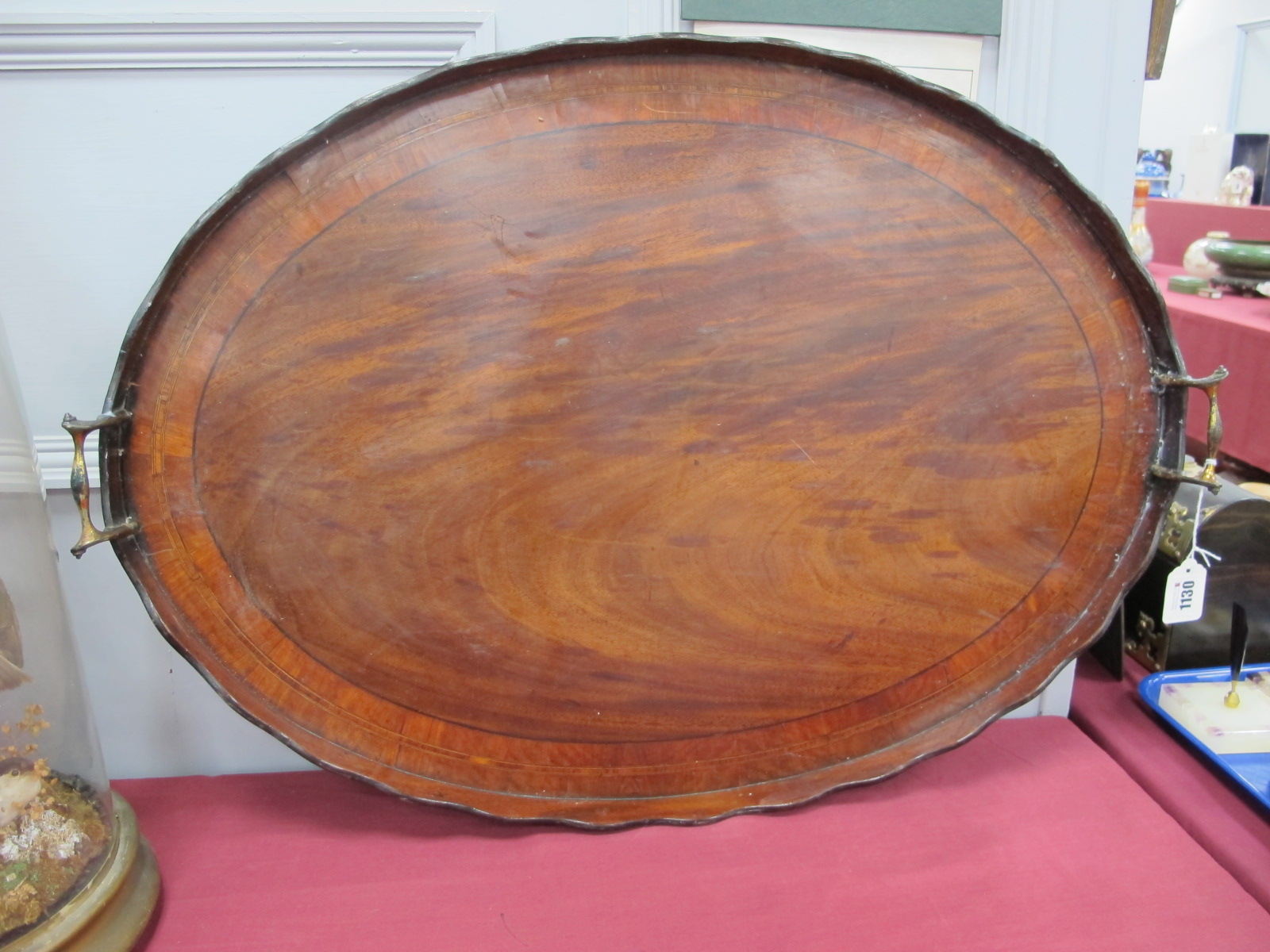 An Early XX Century Mahogany Oval Twin Handled Tray, with crossbanding and shaped gallery.