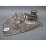 An Early XX Century Pewter WMF Style Desk Standish, the shaped rectangular base cast with a winged