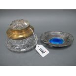 An Art Nouveau Pewter Dish, of oval form with pierced floral handles and turquoise enamel centre,